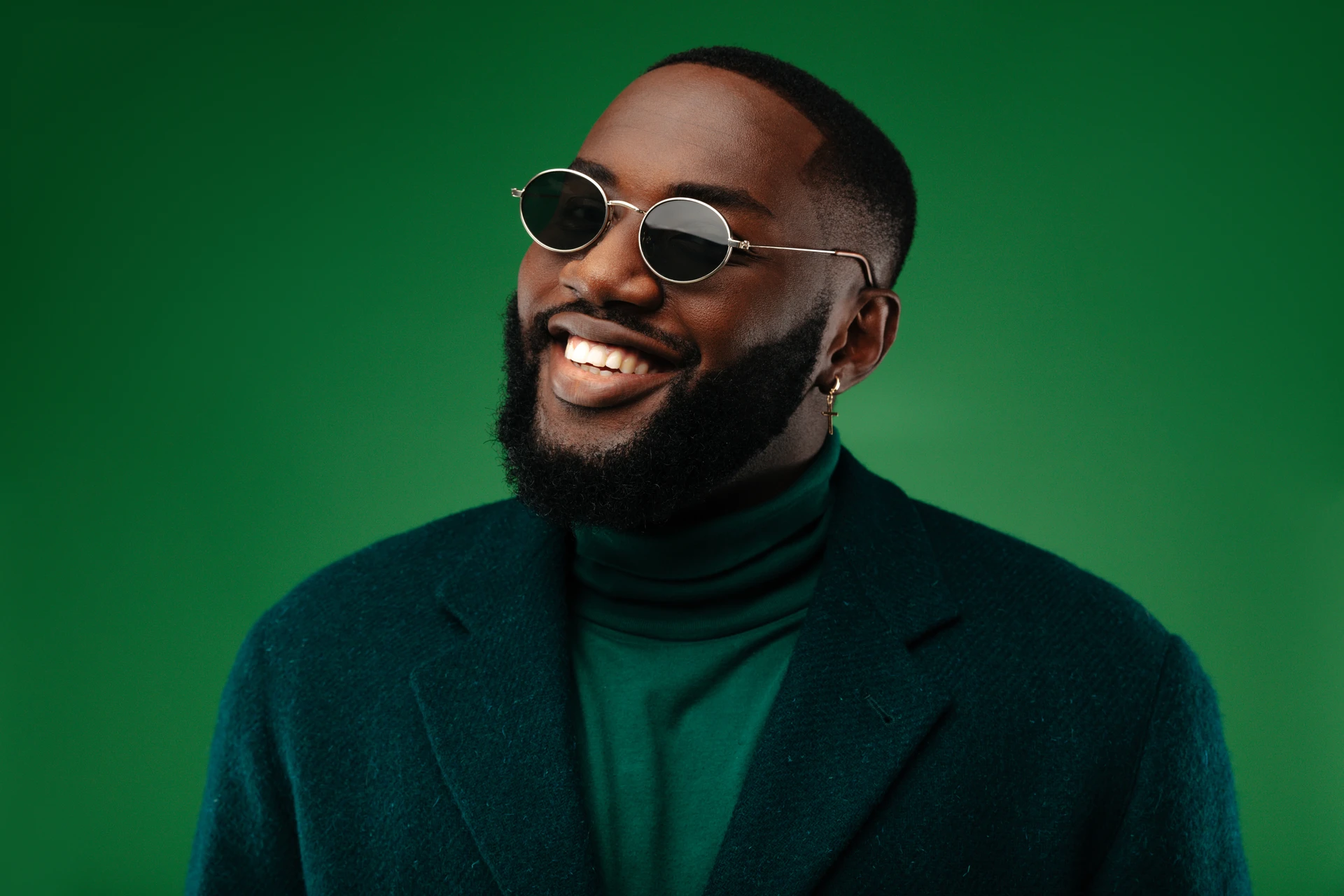 Close up photo of a person wearing green