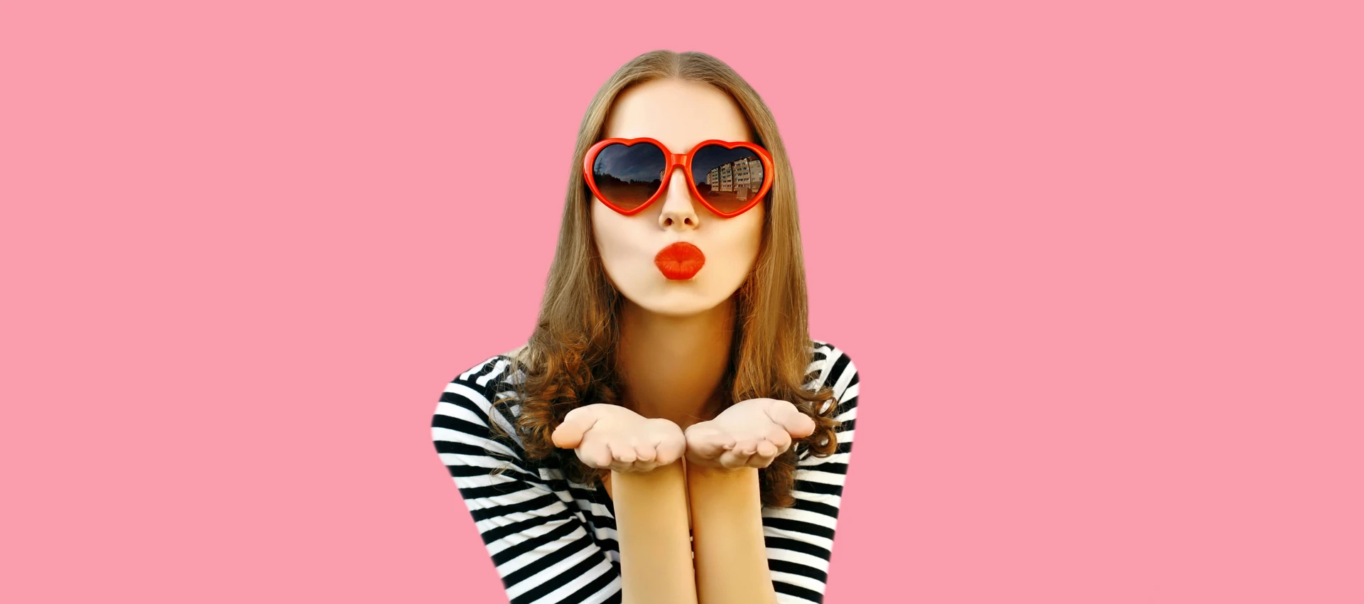 Close up photo of a person wearing pink